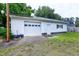 Spacious detached garage with white siding and ample parking space at 2016 Tryon Rd, Raleigh, NC 27603