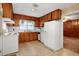 Functional kitchen with essential appliances and wood cabinetry, ready for updates at 2016 Tryon Rd, Raleigh, NC 27603
