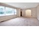 Bright living room with large window and archway leading to dining area at 2016 Tryon Rd, Raleigh, NC 27603