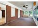 Relaxing screened-in porch with brick accents and a comfortable porch swing at 2016 Tryon Rd, Raleigh, NC 27603