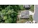 Home aerial view featuring a patio with outdoor seating, screened porch and landscaped yard at 212 Hardwick St, Clayton, NC 27527
