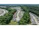 Aerial view of a neighborhood surrounded by mature trees and lush landscaping at 212 Hardwick St, Clayton, NC 27527