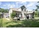 A spacious backyard with a well-manicured lawn, patio, and grilling area at 212 Hardwick St, Clayton, NC 27527