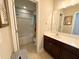 Bathroom featuring a tub, shower, sink, vanity, and a framed art hanging on the wall at 212 Hardwick St, Clayton, NC 27527