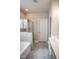 This bathroom features a shower, a bathtub, tile flooring, and a single vanity at 212 Hardwick St, Clayton, NC 27527