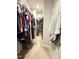 Walk-in closet featuring hanging racks, shelves, and carpeted flooring at 212 Hardwick St, Clayton, NC 27527