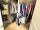 Spacious walk-in closet with ample hanging space and shelving for optimal storage and organization at 212 Hardwick St, Clayton, NC 27527