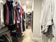 Walk-in closet featuring hanging racks, shelves, and carpeted flooring at 212 Hardwick St, Clayton, NC 27527