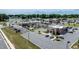 Aerial view of commercial area with lake nearby and ample parking at 212 Hardwick St, Clayton, NC 27527