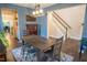 Cozy dining room with wooden table, area rug, and staircase access at 212 Hardwick St, Clayton, NC 27527