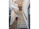 Inviting entryway featuring a staircase, hardwood floors, and a rustic sliding barn door at 212 Hardwick St, Clayton, NC 27527