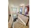 Bright foyer featuring a front door with transom window, hardwood floors, and modern chandelier at 212 Hardwick St, Clayton, NC 27527