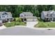 Aerial view of a charming two-story home with a three car garage in a residential area at 212 Hardwick St, Clayton, NC 27527