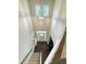 Bright foyer featuring a front door with transom window, hardwood floors, and modern chandelier at 212 Hardwick St, Clayton, NC 27527