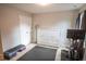 Bright home gym featuring exercise equipment, a large cabinet and a window at 212 Hardwick St, Clayton, NC 27527