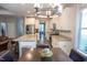 Bright, open kitchen featuring granite countertops, stainless steel appliances and white cabinetry at 212 Hardwick St, Clayton, NC 27527
