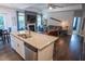 Beautiful open floorplan kitchen featuring granite countertops and stainless steel appliances at 212 Hardwick St, Clayton, NC 27527