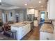 Bright, open kitchen featuring granite countertops, stainless steel appliances and white cabinetry at 212 Hardwick St, Clayton, NC 27527