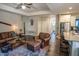 Comfortable living room with leather sofa, chair, ottoman and stylish decor at 212 Hardwick St, Clayton, NC 27527
