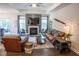 A warm and inviting living room with hardwood floors, a fireplace, and comfortable seating at 212 Hardwick St, Clayton, NC 27527