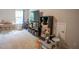 Bright playroom with blue curtains, TV, shelving units, desk, and play market at 212 Hardwick St, Clayton, NC 27527