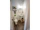 Charming powder room with elegant fixtures, stylish vanity, and modern accents at 212 Hardwick St, Clayton, NC 27527