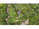 Aerial view of property showcasing mature trees and neighboring homes at 220 Dalton Dr, Raleigh, NC 27615