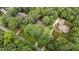 Stunning aerial view of a home nestled among lush, mature trees in a quiet neighborhood at 220 Dalton Dr, Raleigh, NC 27615