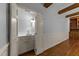 This small bar has a white cabinet and countertop with a sink and modern light fixture at 220 Dalton Dr, Raleigh, NC 27615