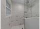 Shower with white marble and glass door with shower head at 220 Dalton Dr, Raleigh, NC 27615
