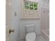 Bathroom features a white toilet and window with matching white shutters at 220 Dalton Dr, Raleigh, NC 27615
