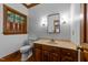Bathroom with wood vanity, stained wood window trim and fixtures at 220 Dalton Dr, Raleigh, NC 27615