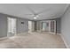 Spacious primary bedroom with neutral walls, plush carpeting and a ceiling fan at 220 Dalton Dr, Raleigh, NC 27615