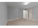 Bedroom with neutral carpeting, white trim, and a double door closet at 220 Dalton Dr, Raleigh, NC 27615