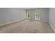 Spacious bedroom with neutral walls, plush carpeting and natural light at 220 Dalton Dr, Raleigh, NC 27615