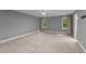 Empty bedroom with carpet, neutral paint, ceiling fan, and ensuite access at 220 Dalton Dr, Raleigh, NC 27615