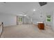 Bonus room with a bar and carpeting featuring two windows at 220 Dalton Dr, Raleigh, NC 27615