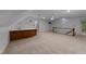 Open-concept bonus room has a bar and a staircase to a second floor at 220 Dalton Dr, Raleigh, NC 27615