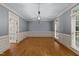 Formal dining area with wood flooring, neutral wall colors, and a modern lighting fixture at 220 Dalton Dr, Raleigh, NC 27615