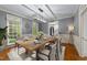 Formal dining room with an elongated wood table, decor, and modern lighting fixture at 220 Dalton Dr, Raleigh, NC 27615