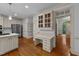 Kitchen with white cabinets, stainless appliances, and a built-in desk area at 220 Dalton Dr, Raleigh, NC 27615