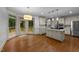 This is a bright eat-in kitchen with an island, white cabinetry and access to the outdoor deck at 220 Dalton Dr, Raleigh, NC 27615