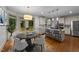 Bright eat-in kitchen with island, stainless appliances, and access to the outdoor deck at 220 Dalton Dr, Raleigh, NC 27615