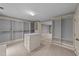 Walk-in closet with custom shelving, drawers, and a central dresser at 220 Dalton Dr, Raleigh, NC 27615