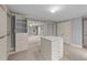 Walk-in closet with custom shelving, drawers, and a central dresser at 220 Dalton Dr, Raleigh, NC 27615