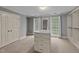 Bright walk-in closet with lots of storage and natural light from two large windows at 220 Dalton Dr, Raleigh, NC 27615