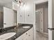 Bathroom featuring granite countertop, double sinks, and framed mirrors at 2207 Cameron Pond Dr, Cary, NC 27519