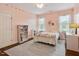 Charming bedroom featuring colorful decor and a functional desk area at 2207 Cameron Pond Dr, Cary, NC 27519