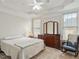 Serene bedroom with tray ceiling, ample natural light, and charming decor at 2207 Cameron Pond Dr, Cary, NC 27519