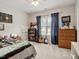 Bedroom featuring a window for natural light, desk, and personal touches at 2207 Cameron Pond Dr, Cary, NC 27519